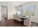 Elegant dining room with large windows, a modern chandelier and hardwood floors at 722 Clegg Farm Dr, York, SC 29745