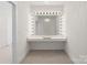 Dedicated dressing area featuring a well-lit vanity with a large mirror, perfect for personal grooming and style at 722 Clegg Farm Dr, York, SC 29745