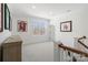 Upper level hallway that is naturally lit and features unique sports decor, adding character to the space at 722 Clegg Farm Dr, York, SC 29745