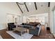 Spacious living room featuring high ceilings, wood beams, an open layout to the kitchen, and hardwood floors at 722 Clegg Farm Dr, York, SC 29745