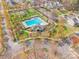 Stunning aerial view of a community pool and surrounding neighborhood with mature trees and well-maintained landscaping at 7554 Coastal Way, Huntersville, NC 28078