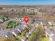 Aerial view of 7554 Coastal Way in a neighborhood with wooded surroundings and a body of water nearby at 7554 Coastal Way, Huntersville, NC 28078