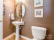 Stylish powder room features pedestal sink, updated fixtures and modern design at 7554 Coastal Way, Huntersville, NC 28078