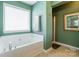 Bright bathroom featuring a soaking tub and separate shower at 7554 Coastal Way, Huntersville, NC 28078