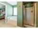 Spacious bathroom with soaking tub and glass-enclosed shower at 7554 Coastal Way, Huntersville, NC 28078