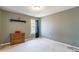 Cozy bedroom featuring neutral walls, carpet, and natural light at 7554 Coastal Way, Huntersville, NC 28078
