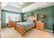 Inviting bedroom features wood furniture, carpet, and plenty of natural light at 7554 Coastal Way, Huntersville, NC 28078