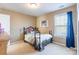 Bedroom with carpet, blue curtains and ample light at 7554 Coastal Way, Huntersville, NC 28078