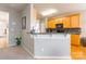 Kitchen bar opens into the kitchen with wood cabinets and granite countertops at 7554 Coastal Way, Huntersville, NC 28078