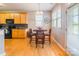 Bright breakfast nook with natural light, open to kitchen with wood cabinets at 7554 Coastal Way, Huntersville, NC 28078