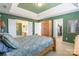 Comfortable main bedroom with an armoire, ensuite, and walk-in closet access at 7554 Coastal Way, Huntersville, NC 28078