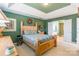 Spacious main bedroom featuring a tray ceiling and ensuite bathroom access at 7554 Coastal Way, Huntersville, NC 28078