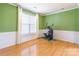 Versatile room with hardwood floors, soft natural light, and a calming atmosphere at 7554 Coastal Way, Huntersville, NC 28078