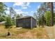 Picture of the home's backyard showing the lawn, fence, and siding at 8007 Willhill Rd, Mint Hill, NC 28227