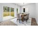 Dining area with large sliding doors for natural light and access to backyard at 8007 Willhill Rd, Mint Hill, NC 28227