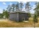 View of the home's exterior showing the yard, siding, and windows at 8007 Willhill Rd, Mint Hill, NC 28227