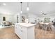 Bright and airy kitchen with a center island, seamlessly connects to the adjacent dining and living spaces at 8007 Willhill Rd, Mint Hill, NC 28227