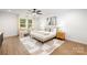 A serene main bedroom featuring plush decor, large windows, and modern design at 8007 Willhill Rd, Mint Hill, NC 28227