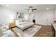 A serene main bedroom featuring plush decor, large windows, and modern design at 8007 Willhill Rd, Mint Hill, NC 28227