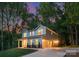 A charming gray two-story home features a well-manicured lawn and an attached two-car garage with driveway at 8021 Willhill Rd, Mint Hill, NC 28227