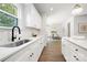 Updated kitchen with stainless steel appliances and marble backsplash with a view to the dining room at 8021 Willhill Rd, Mint Hill, NC 28227