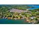 Stunning community aerial view with lake access, surrounded by lush green trees and well-maintained properties at 8518 Christalina Ln, Denver, NC 28037
