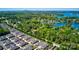 Aerial shot of a community with manicured lawns, mature trees, and access to a beautiful lake at 8518 Christalina Ln, Denver, NC 28037