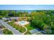 Overhead view of community amenities: pool, clubhouse, tennis court, pond, and well maintained grounds at 8518 Christalina Ln, Denver, NC 28037