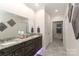 The bathroom features double sinks, granite countertops, framed mirrors and tiled floors at 8518 Christalina Ln, Denver, NC 28037