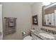 This bathroom features neutral colors and granite countertops at 8518 Christalina Ln, Denver, NC 28037