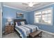 Charming bedroom features blue walls, neutral carpet, and a decorative upholstered headboard at 8518 Christalina Ln, Denver, NC 28037