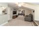 Bonus room equipped with TV and seating, offers potential as an entertainment area at 8518 Christalina Ln, Denver, NC 28037