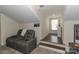 The bonus room offers extra seating and a cozy area for relaxation at 8518 Christalina Ln, Denver, NC 28037