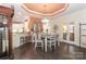 Cozy dining room with a modern chandelier, table set for four, and an open layout at 8518 Christalina Ln, Denver, NC 28037