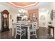 Elegant dining room with a chandelier, stylish decor, and seating for four at 8518 Christalina Ln, Denver, NC 28037