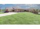Beautiful brick building featuring a covered portico and well-maintained landscaping at 8518 Christalina Ln, Denver, NC 28037
