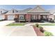 Inviting brick home featuring manicured landscaping and an attached two-car garage at 8518 Christalina Ln, Denver, NC 28037