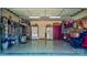 Spacious garage featuring epoxy flooring, ample storage, and two refrigerators for added convenience at 8518 Christalina Ln, Denver, NC 28037