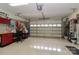This garage features ample storage space and a large garage door with windows at 8518 Christalina Ln, Denver, NC 28037