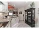 Open kitchen with granite countertops, stainless steel appliances, and an adjacent breakfast bar area at 8518 Christalina Ln, Denver, NC 28037