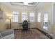 Bright office space with ample natural light from three large windows and stylish furniture at 8518 Christalina Ln, Denver, NC 28037