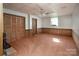 Finished basement with paneled walls and storage space at 916 Rollingwood Dr, Mount Holly, NC 28120