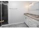Bathroom showcasing walk-in shower, vanity with granite countertop, and modern lighting at 916 Rollingwood Dr, Mount Holly, NC 28120