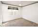 Bright bedroom featuring a window and neutral carpet at 916 Rollingwood Dr, Mount Holly, NC 28120