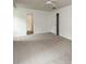 Bright bedroom features neutral carpet, ceiling fan, closet, and ample space at 916 Rollingwood Dr, Mount Holly, NC 28120