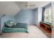 Light blue bedroom with carpet, a ceiling fan, and a cozy window bench at 916 Rollingwood Dr, Mount Holly, NC 28120