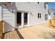 Exterior shot of deck with wooden railing and french doors on home's siding at 916 Rollingwood Dr, Mount Holly, NC 28120