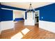 Bright dining room with hardwood floors, adjoining rooms, and stylish decor at 916 Rollingwood Dr, Mount Holly, NC 28120