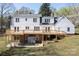 Back of the home showing a two-level deck and access to the covered patio at 916 Rollingwood Dr, Mount Holly, NC 28120