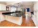 Modern kitchen with stainless steel appliances, granite countertops, and hardwood floors at 916 Rollingwood Dr, Mount Holly, NC 28120